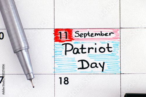 Reminder Patriot Day in calendar with black pen. September 11. photo