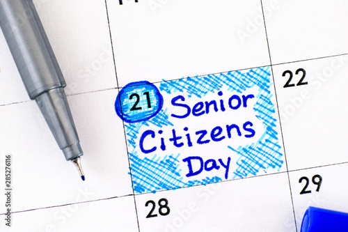 Reminder Senior Citizens Day in calendar with blue pen. August 21st. photo