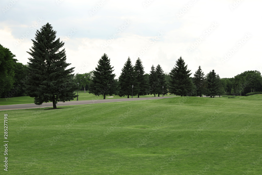 Beautiful view of golf course with green grass Beautiful view of golf course with green grass