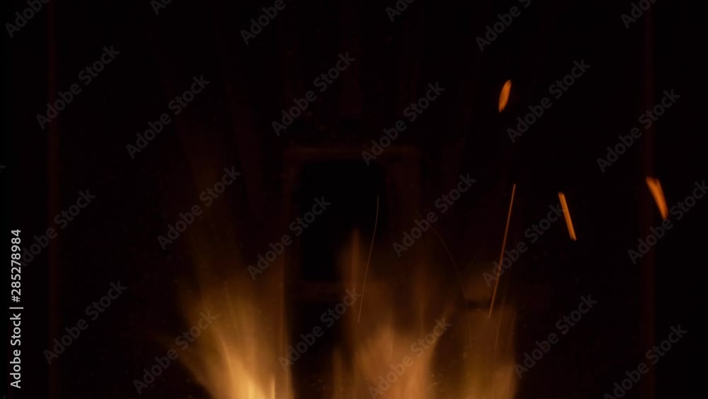 custom made wallpaper toronto digitalClose-up of warm cozy burning fire in a brick fireplace. Black background.