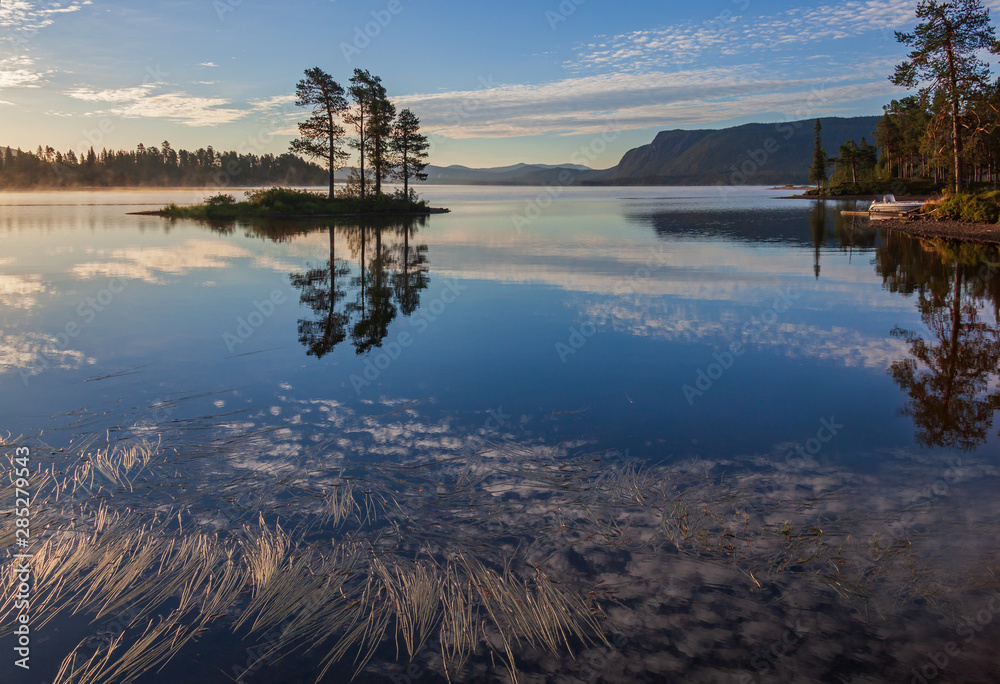 Fototapeta premium Foggy morning at the scenic Lake Saggat near to Arrenjarka in Swedish Lapland, Norrbotten County