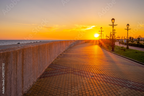 Sunset over the promenade of the resort town.