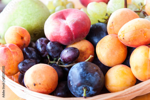 ripe appetizing fruit close-up on a straw plate  D