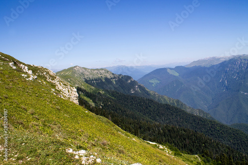 Fototapeta Naklejka Na Ścianę i Meble -  Summer landscape in the mountains and dark blue sky with clouds