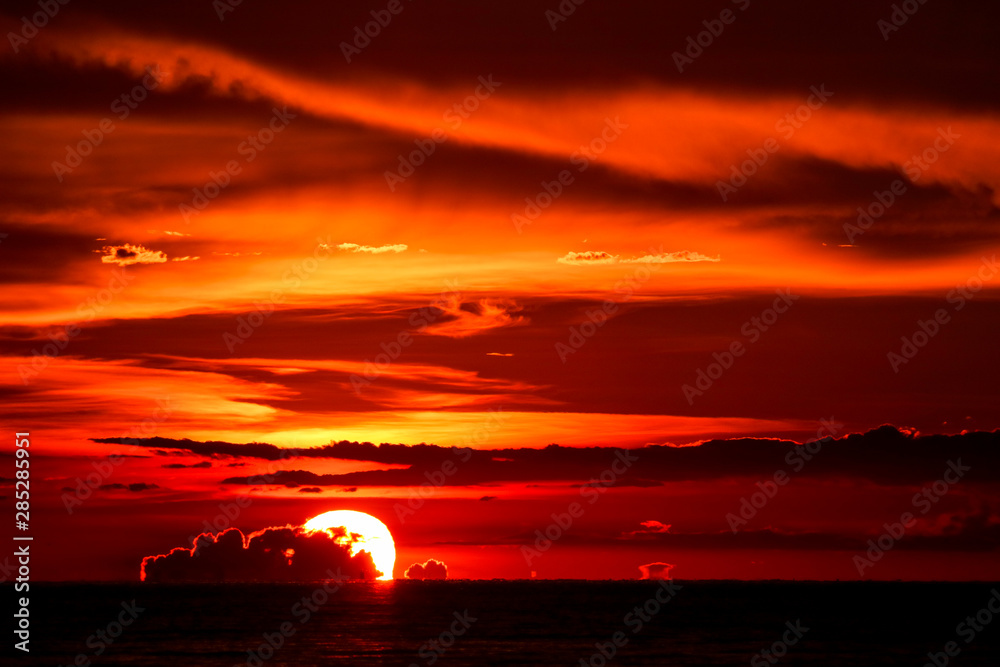 sunset on sea last light red sky silhouette cloud