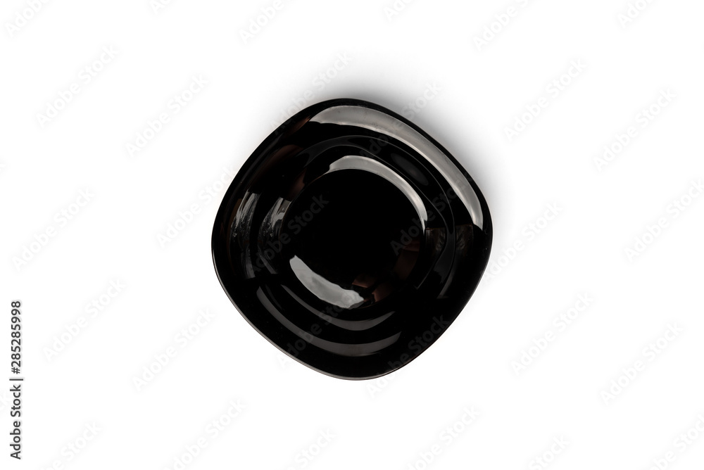 Black plate isolated on white background. Black plate isolated on white background.