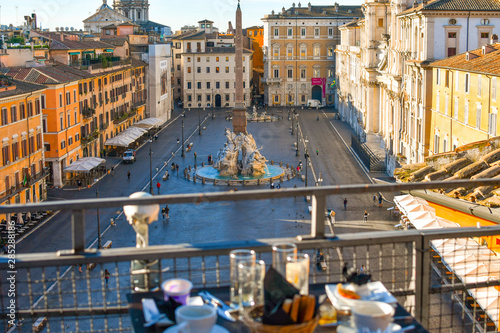 Photography Continental breakfast on a roof top bar overlooking the Piazza Navona on an early summer morning