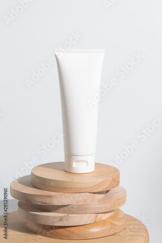 cosmetic mockup cream bottle pakage with beauty spa treatment concept on white background wood dish plate