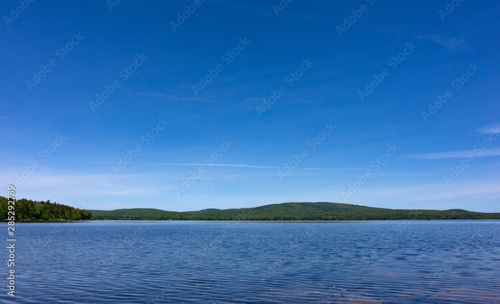 Wide view of Branch Lake in Maine in the summertime