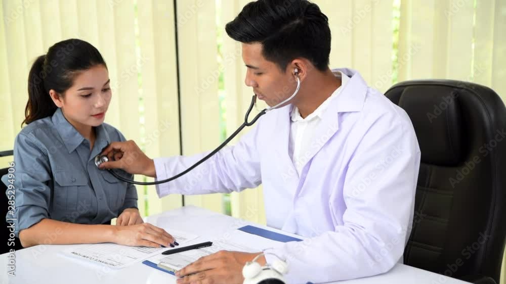 Doctor having medical appointment with patient in hospital Doctor having medical appointment with patient in hospital