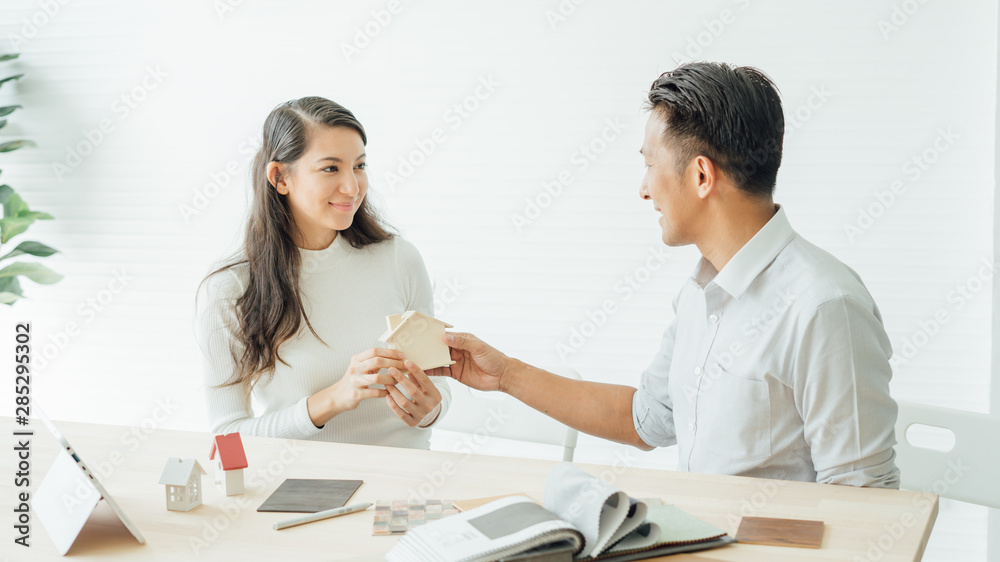 The best choice of house.House owner and architect discussing a choice.Couple dreaming of new home. The best choice of house.House owner and architect discussing a choice.Couple dreaming of new home.