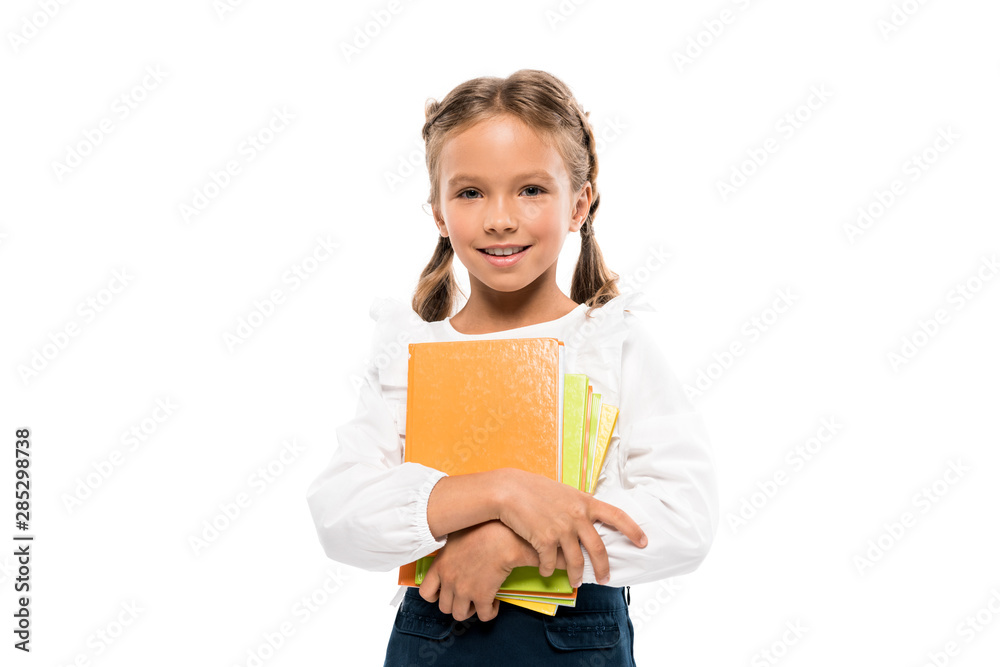 happy schoolkid holding books isolated on white happy schoolkid holding books isolated on white