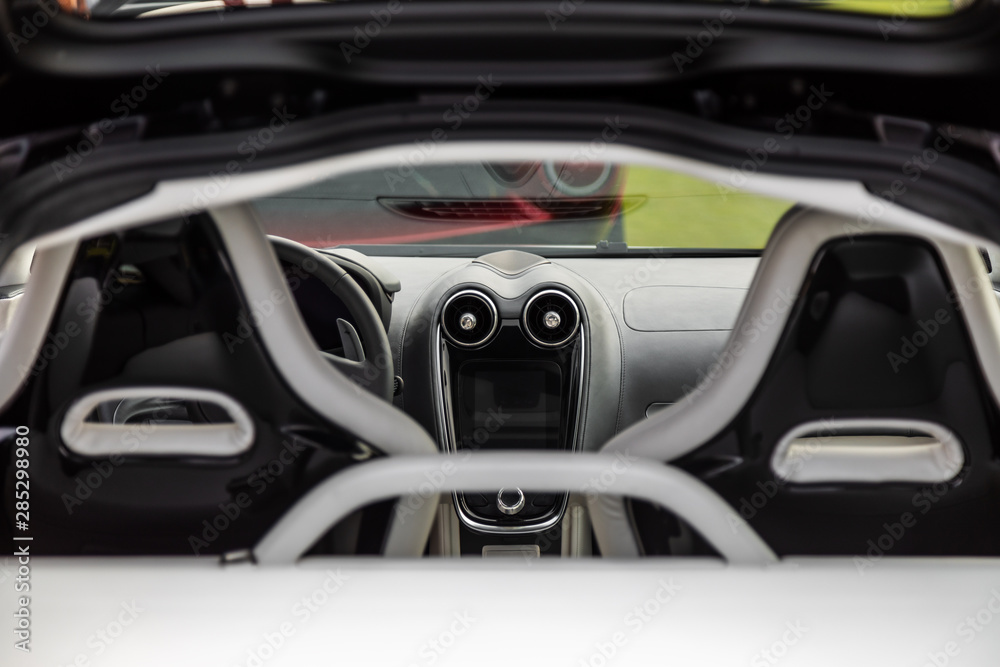Modern concept super car interior design detail - seats, steering wheel and front panel