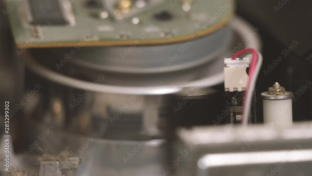 VCR cassette mechanism. Closeup. Rewind of videotape in the