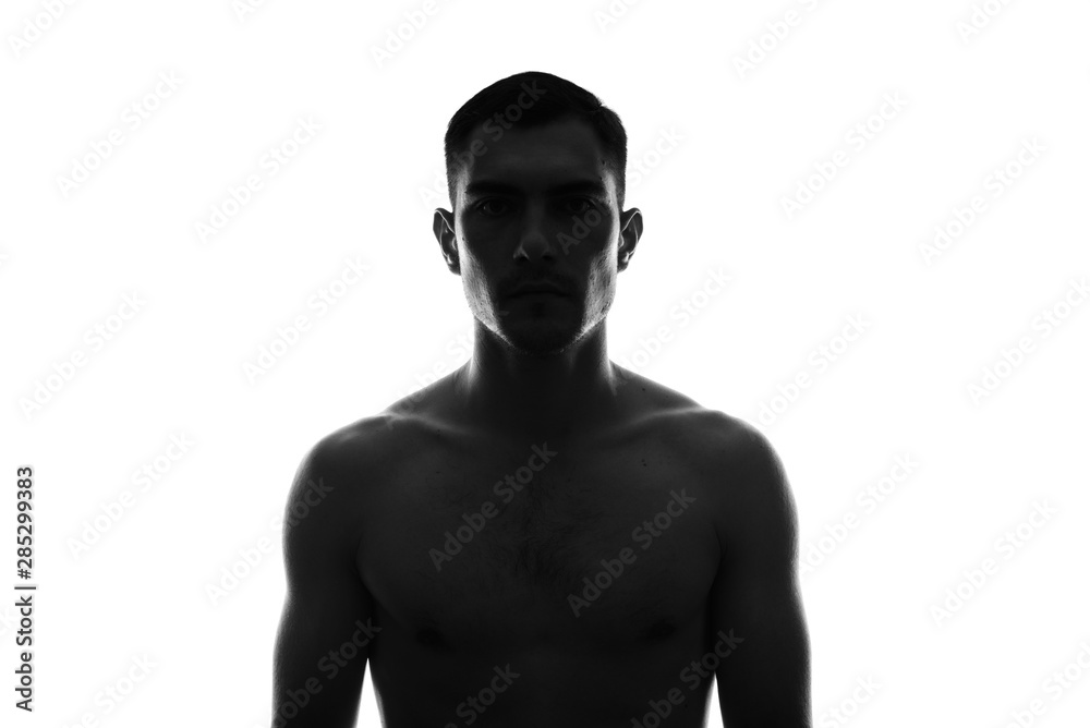 Fototapeta premium black and white Silhouette Portrait of a young man with a naked torso