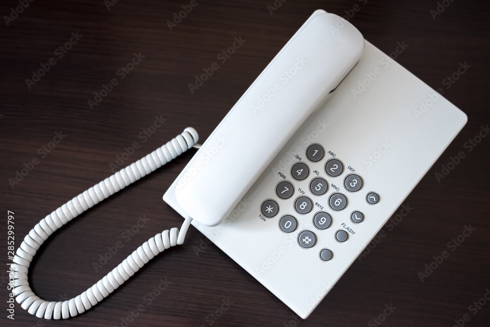 white telephone on wooden background white telephone on wooden background