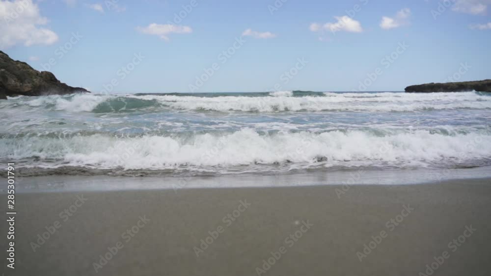 Sea waves splashing on beach shore in slow motion Sea waves splashing on beach shore in slow motion