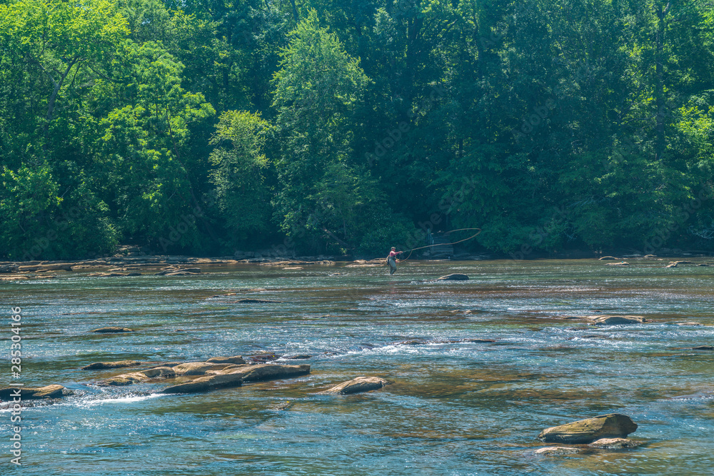 Fototapeta premium Fly fishing on a river