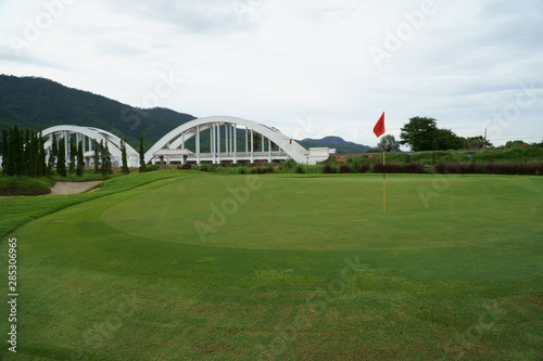 view at the beautiful golf course with white bridge railway © venusangel