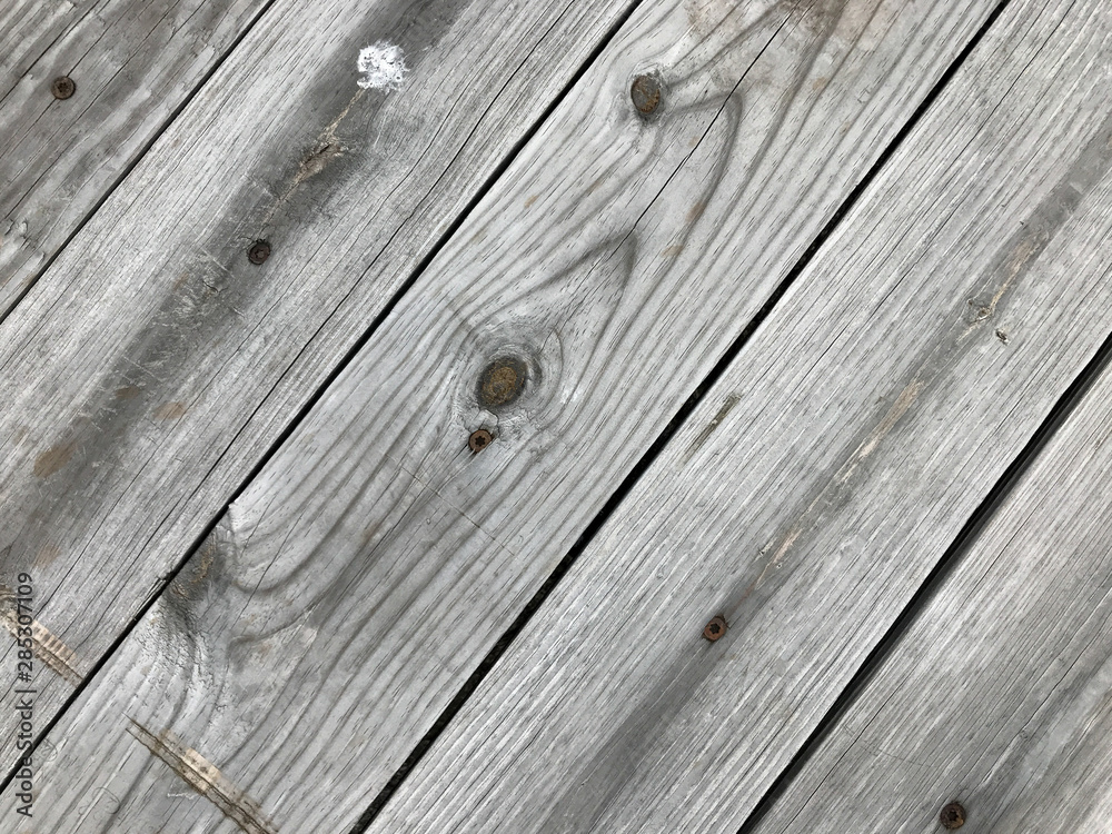 Rows of grayed pressure treated lumber Rows of grayed pressure treated lumber
