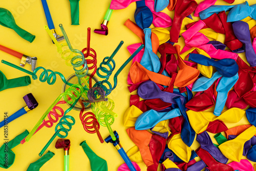 Colored spiral straws and party accessories  flat lay