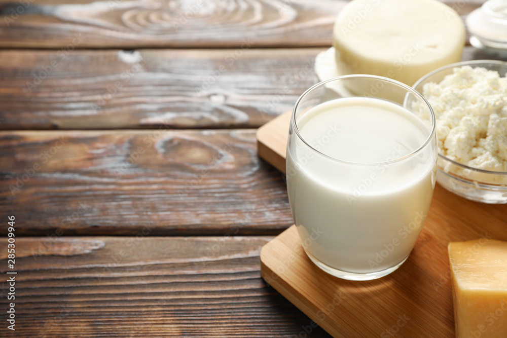 Fresh dairy products on cutting board, close up Fresh dairy products on cutting board, close up