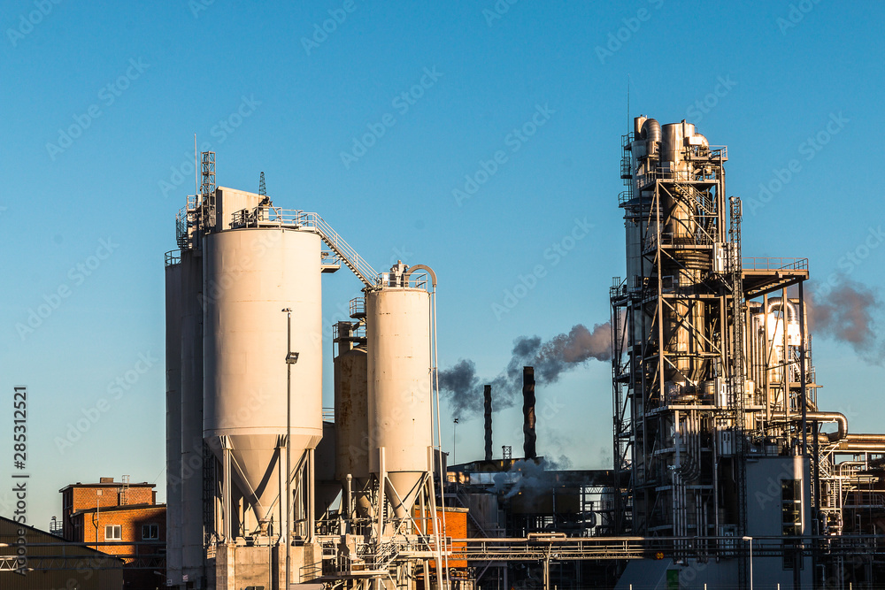 Environmental pollution concept. Pollution and smoke from chimneys of factory or power plant.