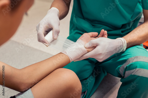 First Aid. Doctors are treating a patient by bandages. Concept first aid and treatment for patients.