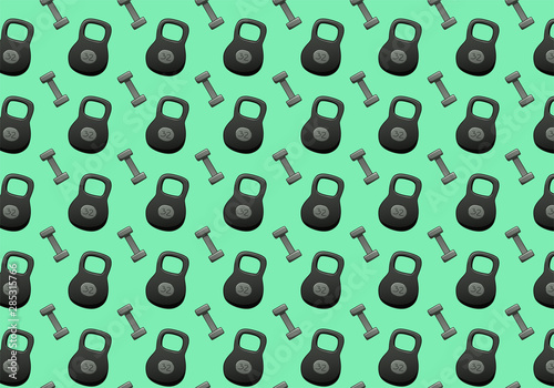 Kettlebells and dumbbells on a green background
