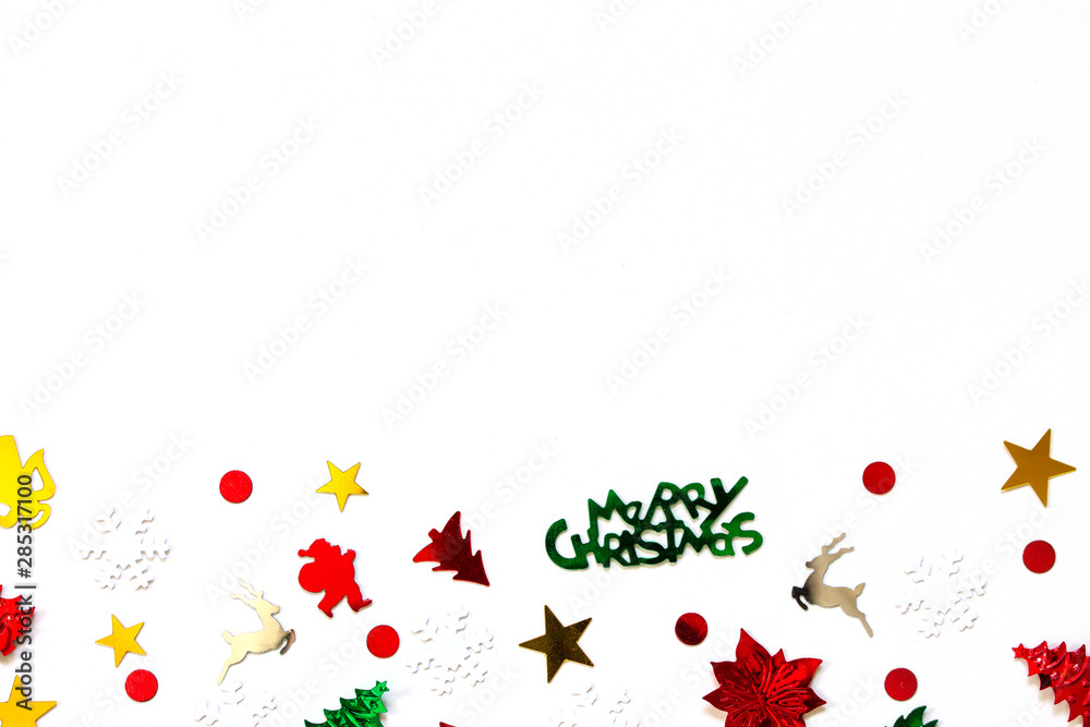 Christmas or new year composition. Christmas confetti isolated on a white background. Top view.