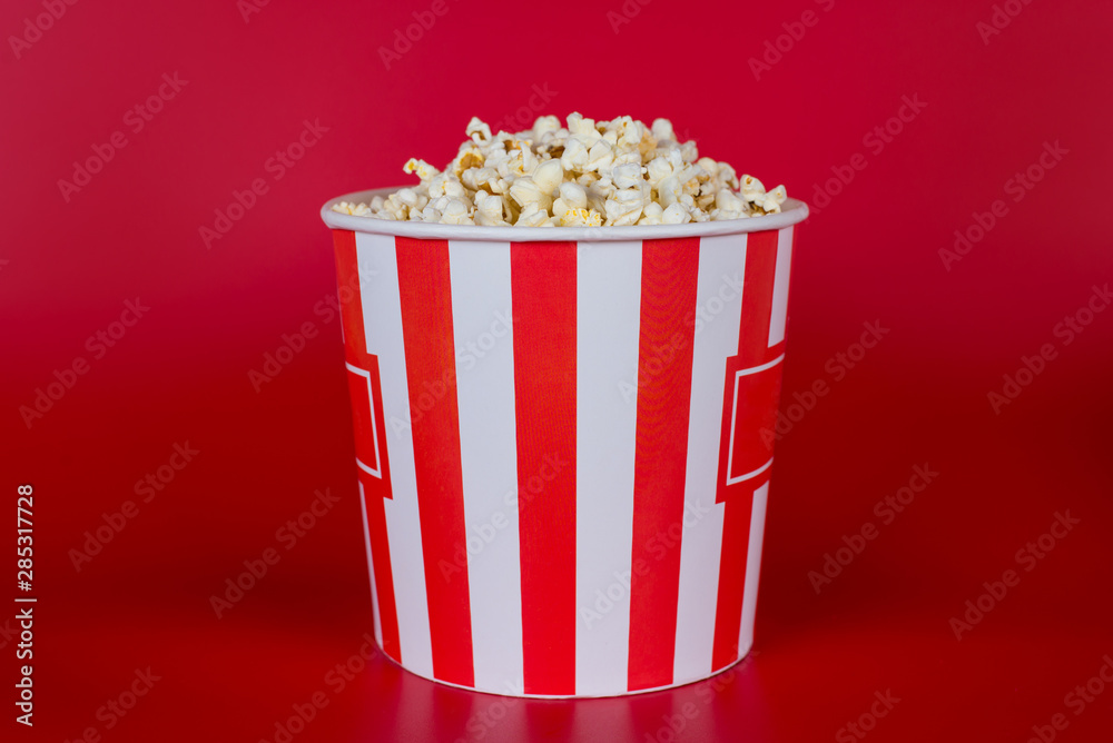 Party night home premiere concept. Full length photo of one single with no people object full of tasty fresh hot spicy popcorn isolated vivid background copyspace Party night home premiere concept. Full length photo of one single with no people object full of tasty fresh hot spicy popcorn isolated vivid background copyspace