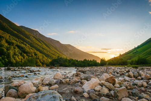 Photography Svaneti landscape at sunset with mountains and river on the trekking and hiking route near Mestia village in Svaneti region, Georgia