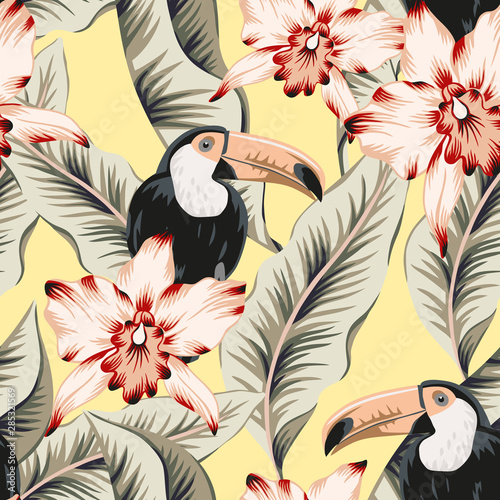 Toucans, pink orchid flowers, banana palm leaves, yellow background. Vector floral seamless pattern. Tropical illustration. Exotic plants, birds. Summer beach design. Paradise nature 