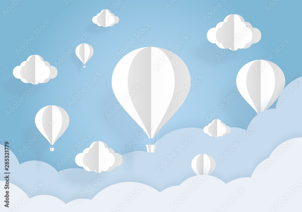 Air balloons in the blue sky with white clouds paper cut. Paper art and origami style.