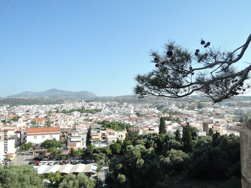 Naklejka premium View from Fortezza above of Greek city Rethymno, harbor and Aegean Sea in the summer