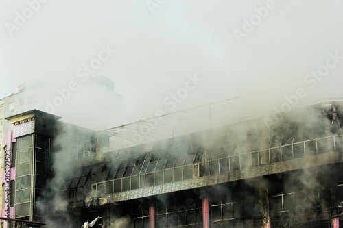 shopping center or mall fire,smoke,fighters,space for copy or text,toned photo