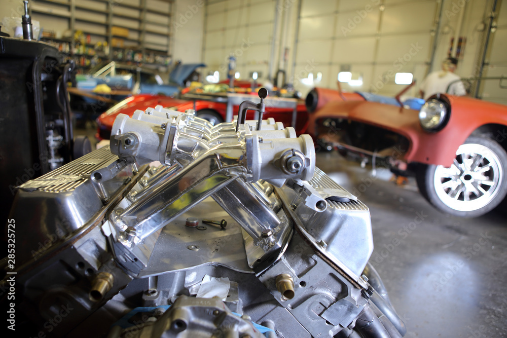 Fototapeta premium A V8 Aluminum racing engine inside a automotive garage.