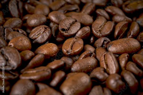 dark background with fragrant brown coffee seeds