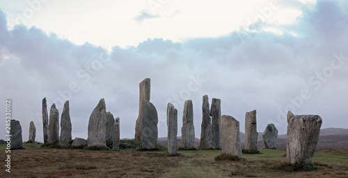 Megalithic stones at sunset on the Isle of Lewis photo