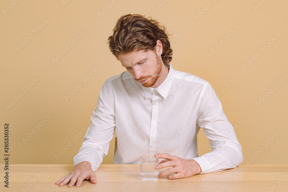 A Man Sitting at the Table