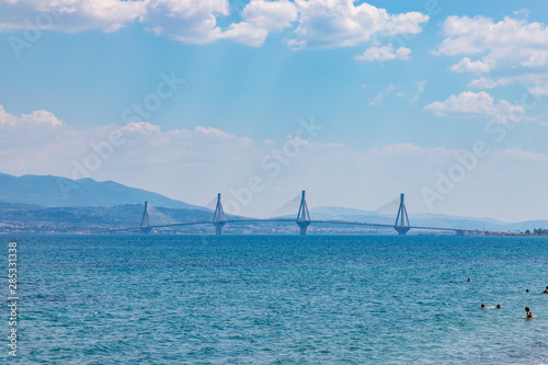 The Charilaos Trikoupis bridge between Antirrio and Rion in Greece seen from the beach in Rion