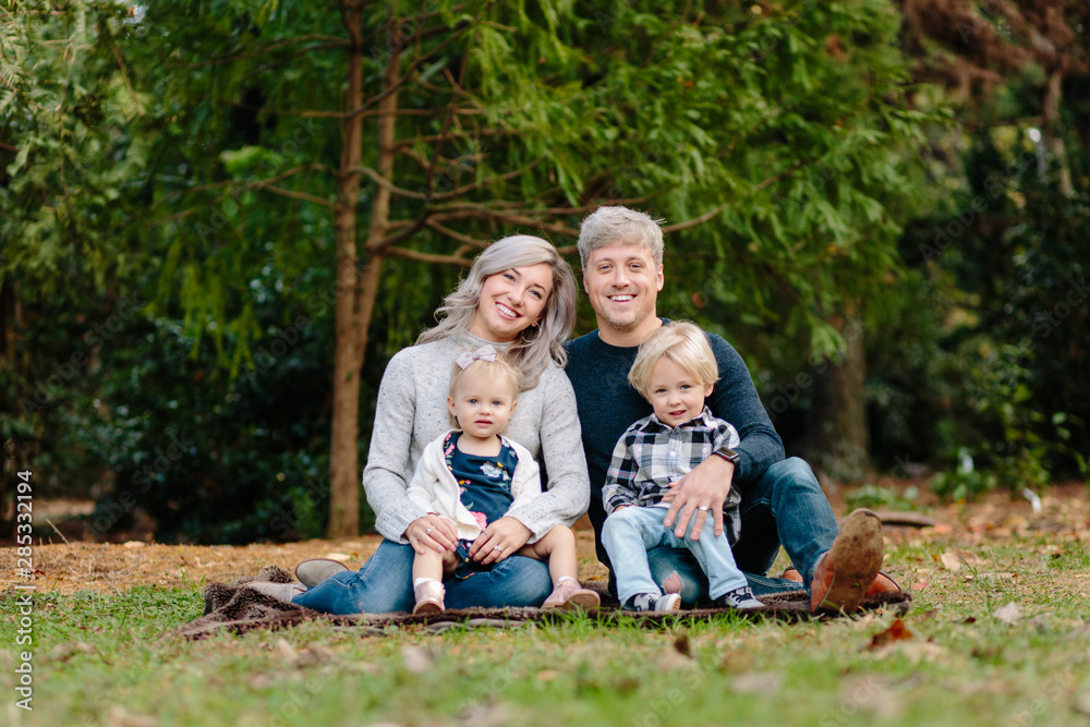Group photo of a beautiful young family together Group photo of a beautiful young family together