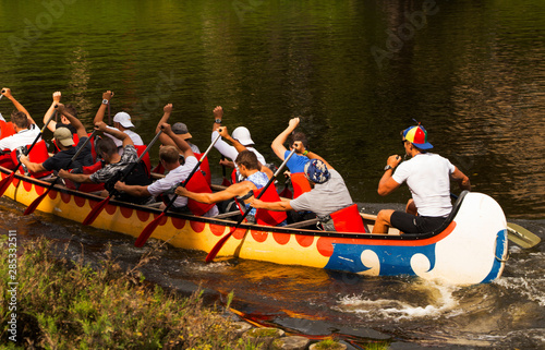 dragon boat on the canal with rowers inside