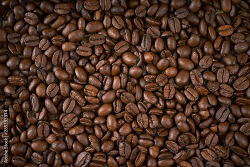dark background with fragrant brown coffee seeds