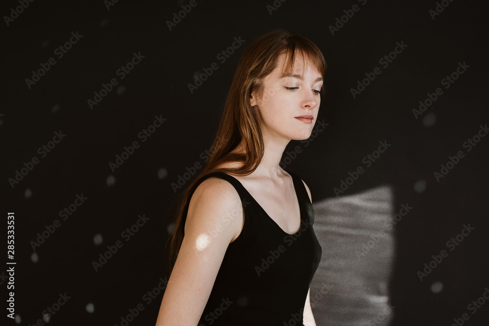 Portrait of young woman on black background Portrait of young woman on black background