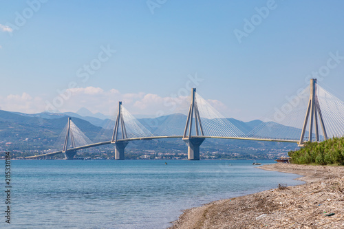 The Charilaos Trikoupis bridge between Antirrio and Rion in Greece seen from the beach in Rion photo