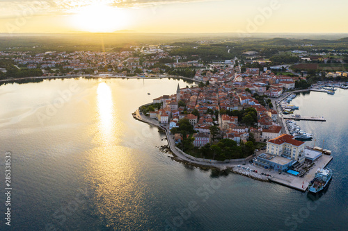 Sunrise over the old city. The city is located on a Peninsula surrounded on three sides by the sea. The view from the top. Copy space.