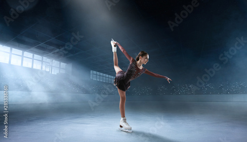 Photography Figure skating couple in professional ice arena.