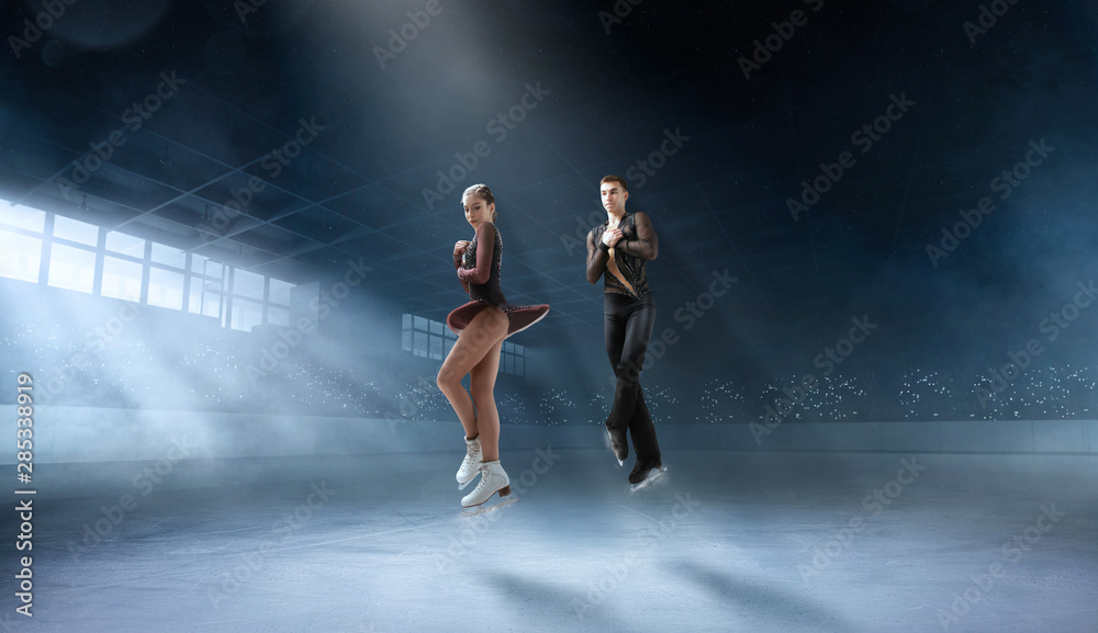 Figure skating couple in professional ice arena. Figure skating couple in professional ice arena.