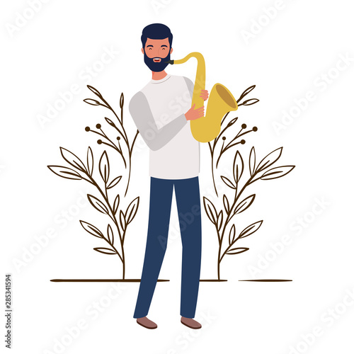 man with saxophone and branches and leaves in the background photo